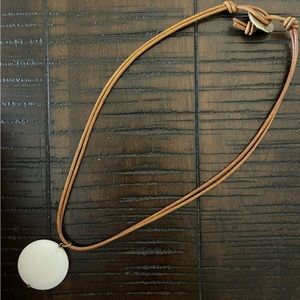 Brown leather necklace with white stone